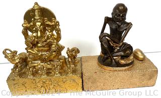 Two (2) Metal Buddhist Statues Mounted on Bricks Including Ganesh and Monk