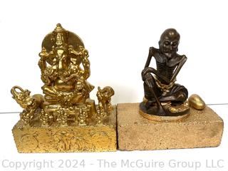 Two (2) Metal Buddhist Statues Mounted on Bricks Including Ganesh and Monk