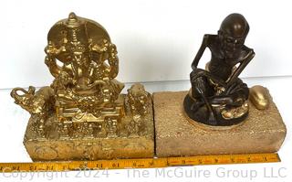 Two (2) Metal Buddhist Statues Mounted on Bricks Including Ganesh and Monk