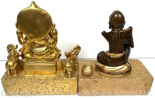 Two (2) Metal Buddhist Statues Mounted on Bricks Including Ganesh and Monk