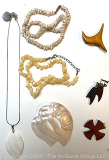 Jewelry Including Puka Bead Necklace, Mother of Pearl Necklace and Carved Wood Brooches