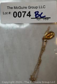 14kt Yellow Gold Religious Medal with Chain.  0.9 grams