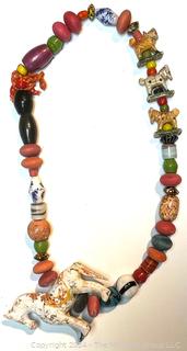 Mixed Art Glass and Clay Bead Necklace with Carved Wood Horse Fetish Center