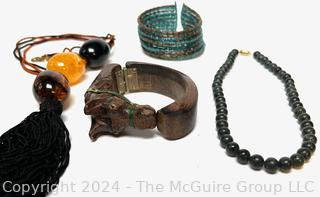 Jewelry Including Carved Wood Horse Bracelet, Beaded Bracelet, Green Stone Bead Necklace and Amber Color Bead Necklace