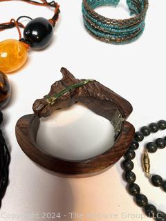 Jewelry Including Carved Wood Horse Bracelet, Beaded Bracelet, Green Stone Bead Necklace and Amber Color Bead Necklace