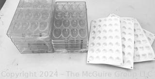 Twelve (12) Chocolate World Polycarbonate Molds #2004 and Four (4) Silicon Mat Mold Trays