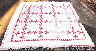 Vintage Hand Stitched Red and White Flour Sack Quilt in the Pinwheel Pattern. Some damage.  80" square 