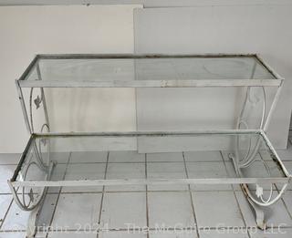 Metal Scroll Work With Glass Shelves Two Tier Plant Stand. Measures 38.5w x 18.5d x 23h"