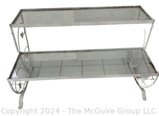 Metal Scroll Work With Glass Shelves Two Tier Plant Stand. Measures 38.5w x 18.5d x 23h"