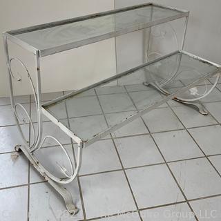 Metal Scroll Work With Glass Shelves Two Tier Plant Stand. Measures 38.5w x 18.5d x 23h"