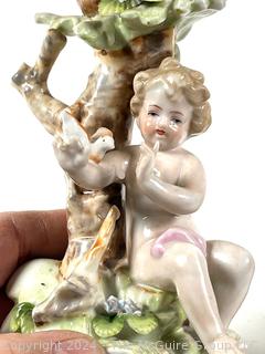 Pair of Cherub Arnart Porcelain Hand Painted Rococo Style Candlestick Holders.  8 1/2" tall.