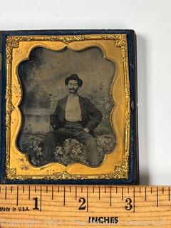 Sixth Plate Daguerreotype Photograph of Man in Hat in Ornate Victorian Gutta Percha Union Case with Velvet Surround. Measures 2.5 x 3"