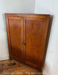 Primitive Pine Two Door Corner Cabinet. Measures 31.5w x 22d x 42.5h"