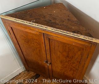 Primitive Pine Two Door Corner Cabinet. Measures 31.5w x 22d x 42.5h"