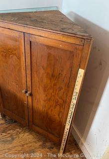 Primitive Pine Two Door Corner Cabinet. Measures 31.5w x 22d x 42.5h"