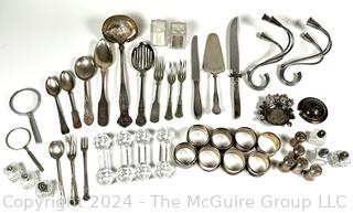 Silver Plate Flatware, Napkin Rings, Candle Holders, Crystal Knife Rest, Etc. Some items found while building Alexandria Square in the 1960's