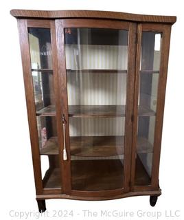 Victorian Oak Bowed Glass Bow Front Curio or China Cabinet. Measures 38w x 15d x 55.5h"
