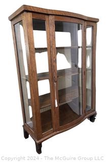 Victorian Oak Bowed Glass Bow Front Curio or China Cabinet. Measures 38w x 15d x 55.5h"
