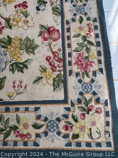 Floral Hook Area Rug on White Ground. Measures 62 x 99"