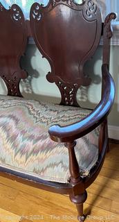 Empire Style Mahogany Shield Back Carved Settee. Measures 39w x 18d x 33h"