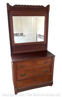 Late 19th Century Eastlake Oak Bureau With Beveled Glass Mirror. Measures 38w x 16.5d x 74h"