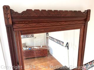 Late 19th Century Eastlake Oak Bureau With Beveled Glass Mirror. Measures 38w x 16.5d x 74h"