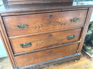 Late 19th Century Eastlake Oak Bureau With Beveled Glass Mirror. Measures 38w x 16.5d x 74h"