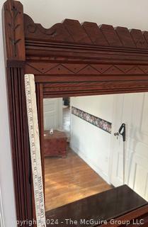 Late 19th Century Eastlake Oak Bureau With Beveled Glass Mirror. Measures 38w x 16.5d x 74h"