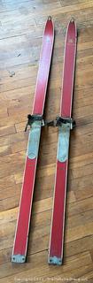 Pair of Vintage Red Laminated Snow Skis Made by Leader. 59" long