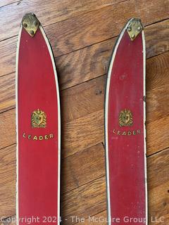 Pair of Vintage Red Laminated Snow Skis Made by Leader. 59" long