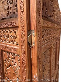 Moroccan Carved Pierced Wood Four (4) Panel Floor Screen.  Needs repair to hinges.  67" tall 80" long (20"W each panel)