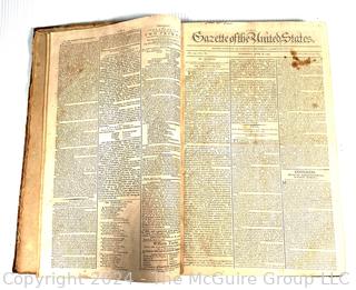 1790-91 Leather Bound Volume with Marbled Covers Containing 96 Issues of the "Gazette of United States" Published Wednesdays and Saturdays by John Fenno.  See Full Issue List Below. Beginning Wednesday, April 14th 1790 and Ending on Saturday, April 2nd 1791. Covers Measure 10 3/8" x 16 3/4".  Pages Measure 10" x 16"