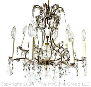 Cast Bronze and Cut Crystal Eight (8) Arm Chandelier.  21" tall 23" diameter
