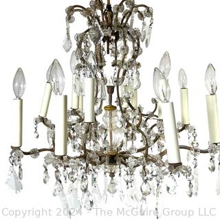 Cast Bronze and Cut Crystal Eight (8) Arm Chandelier.  21" tall 23" diameter
