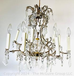 Cast Bronze and Cut Crystal Eight (8) Arm Chandelier.  21" tall 23" diameter
