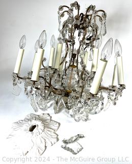 Cast Bronze and Cut Crystal Eight (8) Arm Chandelier.  21" tall 23" diameter
