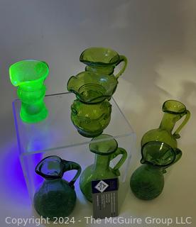 Seven (7) Pieces of Green Crackle Art Glass Pitchers.