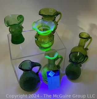 Seven (7) Pieces of Green Crackle Art Glass Pitchers.