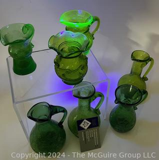 Seven (7) Pieces of Green Crackle Art Glass Pitchers.