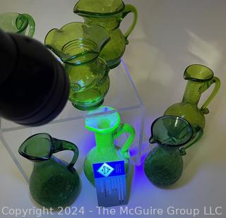 Seven (7) Pieces of Green Crackle Art Glass Pitchers.