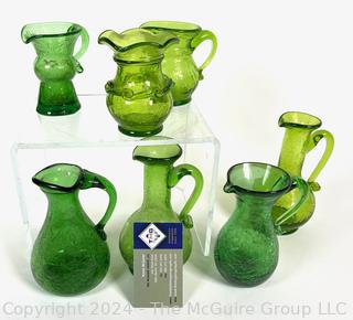 Seven (7) Pieces of Green Crackle Art Glass Pitchers.