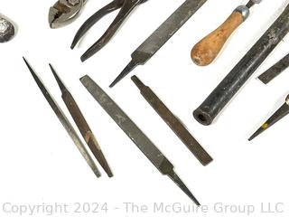 Hand Tools Including Pliers, Files, Chisels, and a Saw