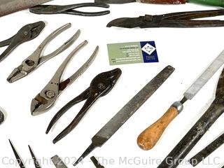 Hand Tools Including Pliers, Files, Chisels, and a Saw