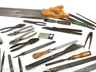 Hand Tools Including Pliers, Files, Chisels, and a Saw