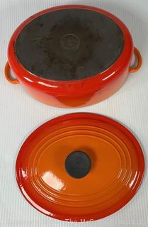 Orange Le Creuset Enameled Cast Iron Oval Dutch Oven