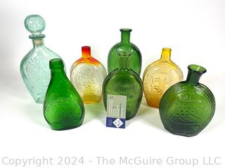 Collection of Colored Glass Whiskey Bottles and Flasks