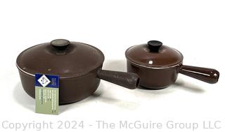 Two (2) Brown Le Creuset Enameled Cast Iron Sauce Pots with Lids