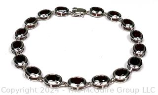 Inset Oval Garnet in Sterling Silver Tennis Bracelet.