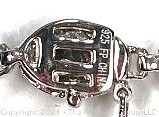 Inset Oval Garnet in Sterling Silver Tennis Bracelet.