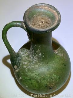 Small Green Blown Glass Pitcher, Possibly of Roman Origin, Lacking Provenance.  3 1/2" tall